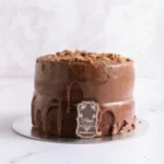 Decadent 2-layer BarOne ganache cake made to order from Petals Gourmet Flowers.